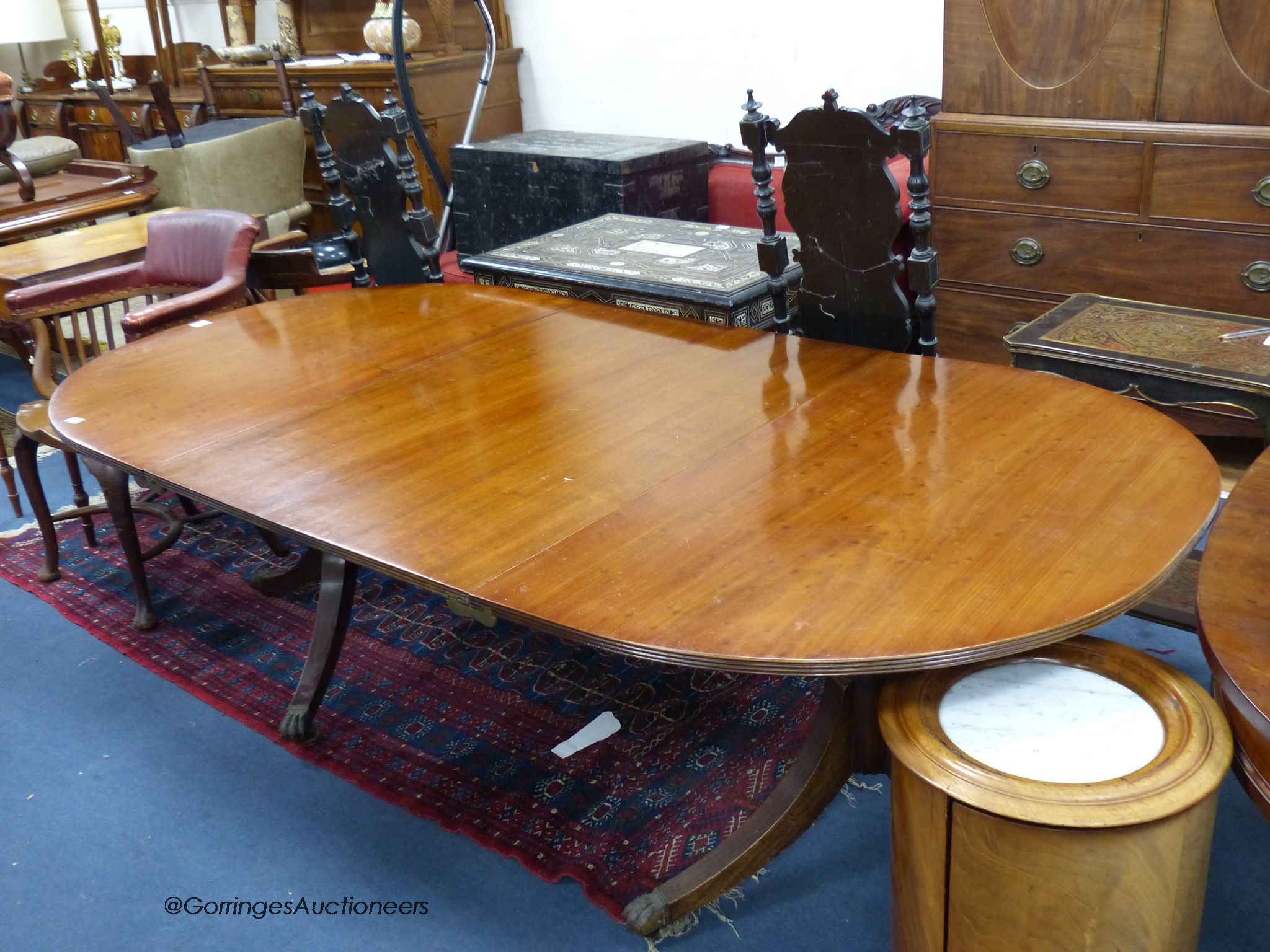 A Georgian style twin pillar dining table. W-215cm extended. D-111, H-69cm.